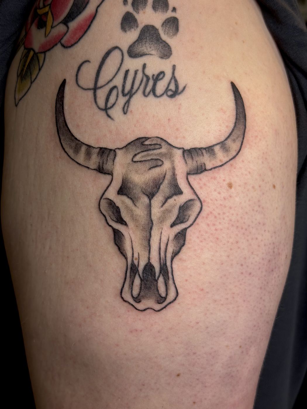 Black and grey longhorn cattle skull tattoo