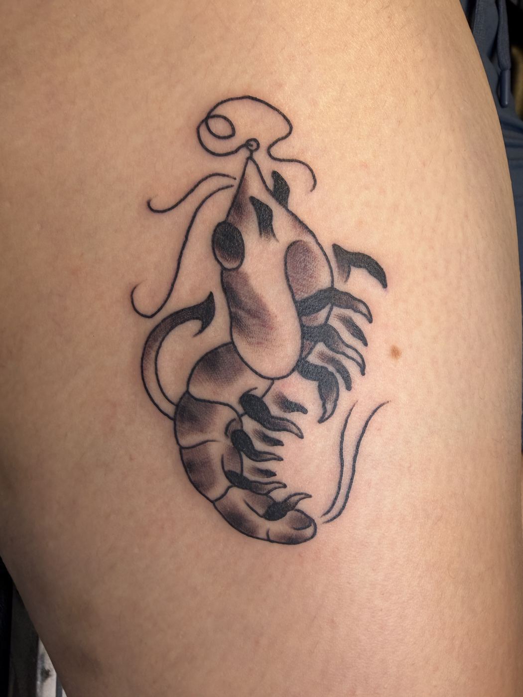 Black and grey crawfish tattoo