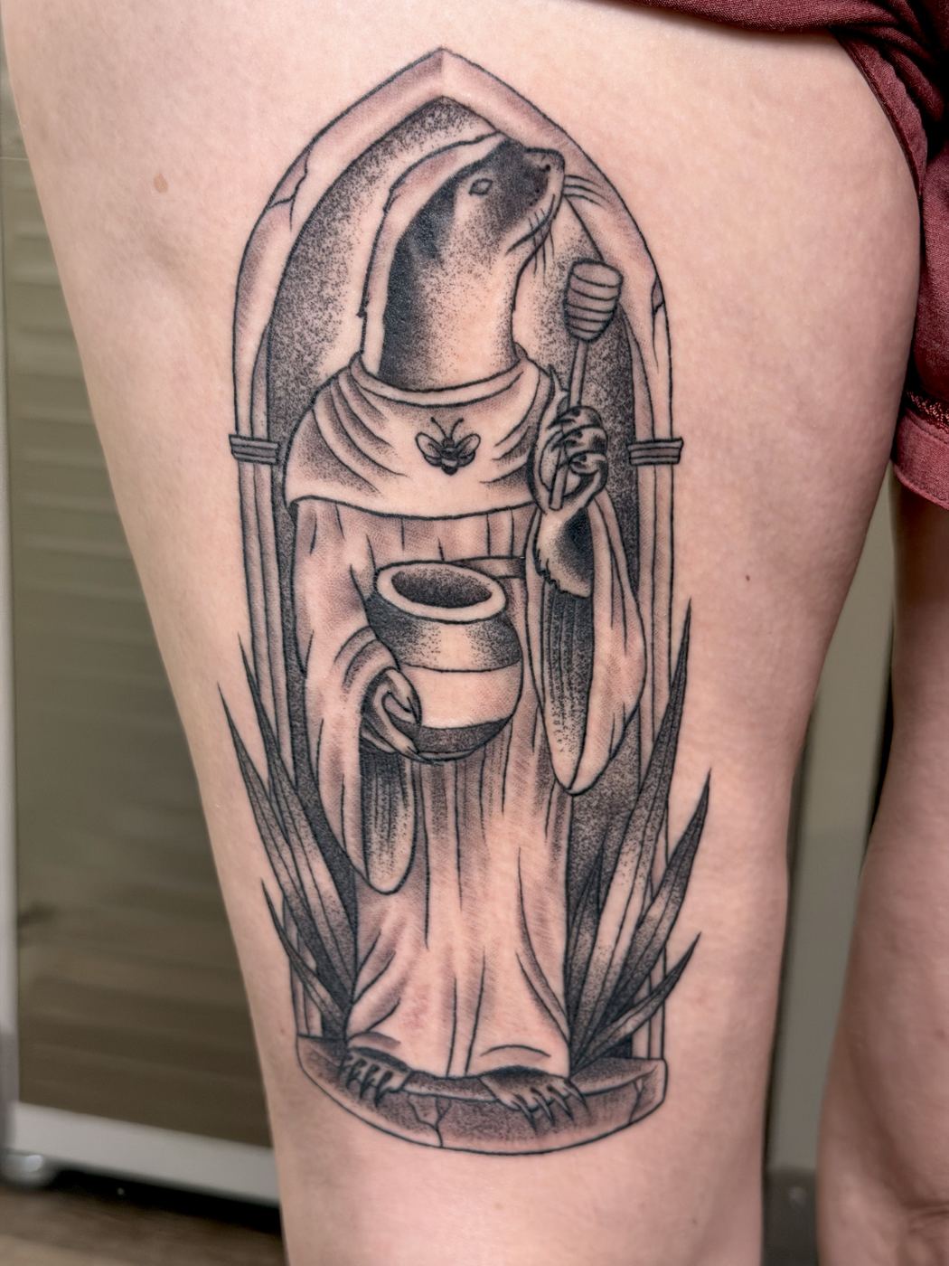 Black and grey dotwork tattoo of an otter monk holding a honey dipper and jar
