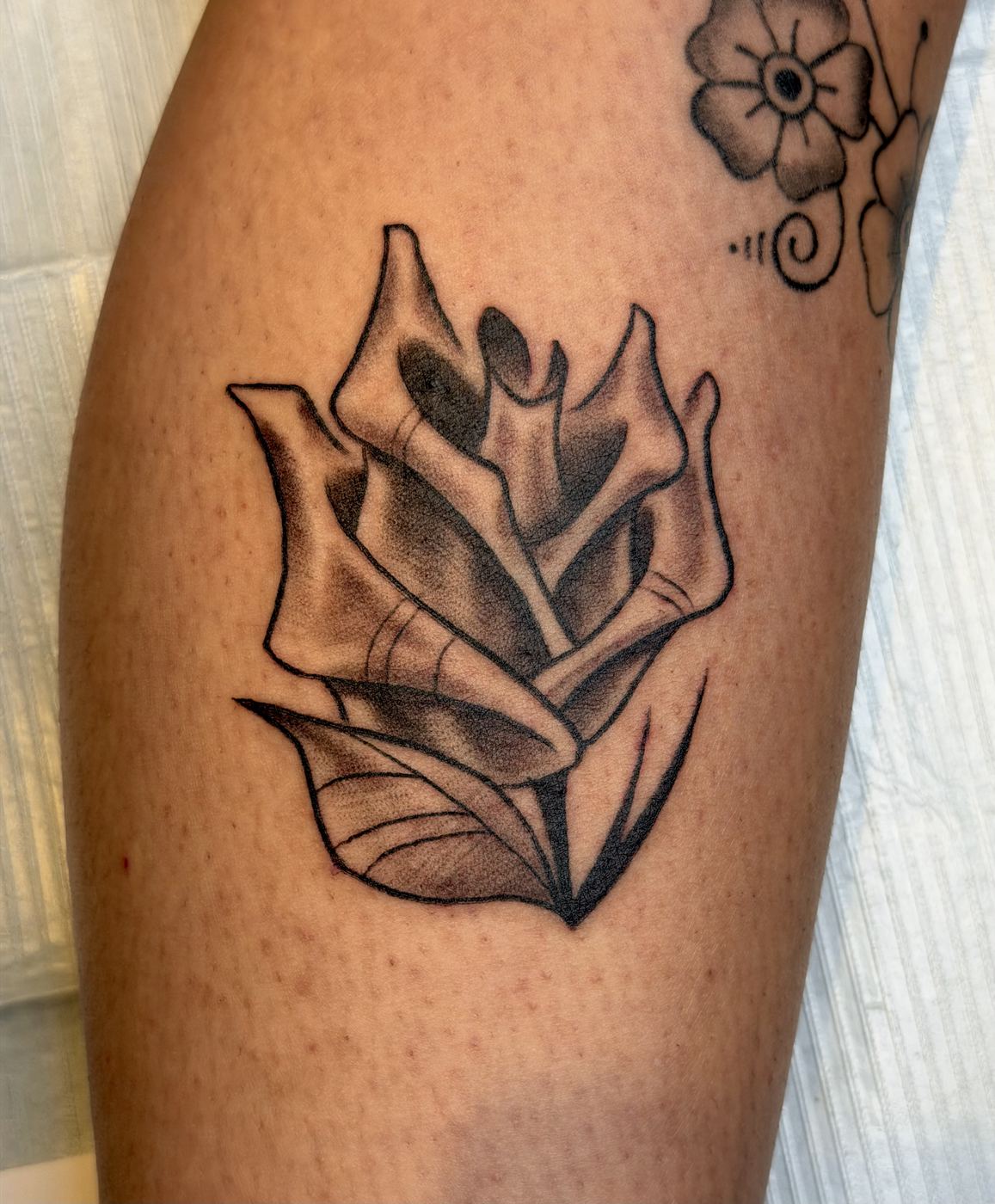 Black and grey tulip flower tattoo